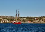 Beautiful old  sailboat under the Danish flag on a sunny day.jpg