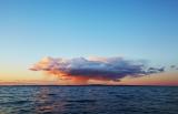 Lonely rain cloud against the clear sky at sunset.jpg