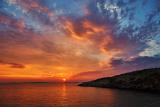 Beautiful colorful sunset at the sea with dramatic clouds and sun shining. .jpg