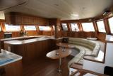 1404535248-17-product-3-Sailing Catamaran Luxury saloon galley wood.JPG